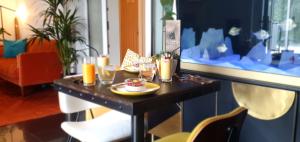 a table with two plates of food on it at The Sleeping Dog Room at The Grumpy Schnauzer BnB Huge Room, Luxe Suite, Private Hot Tub, Breakfast, Gym, Games Room, Farm Stay, Amazing in Airdrie