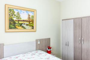 Postel nebo postele na pokoji v ubytování Apto1 COM AR COND WI-FI E TV SMART