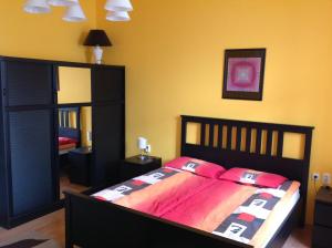 Posteľ alebo postele v izbe v ubytovaní King Apartman