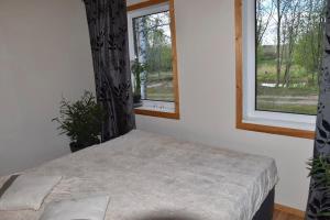 Postel nebo postele na pokoji v ubytování ´RIVER LOUNGE´
