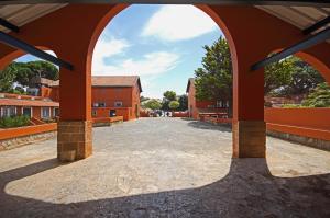 an archway leading into a courtyard of a building at Quinta da Bicuda in Cascais
