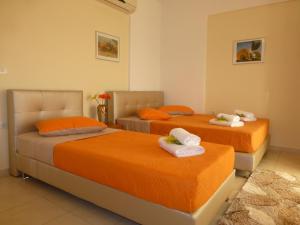 Postel nebo postele na pokoji v ubytování Pavloudis Apartments