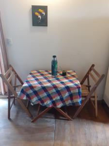 a table with a blanket on it with two chairs at Pez Espada in Punta del Este