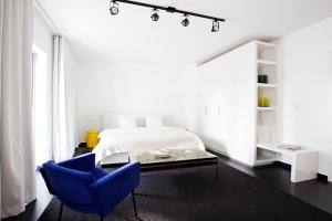 En eller flere senge i et værelse på Blanc Kara- Adults Only