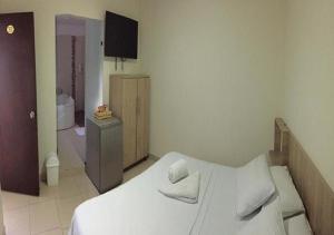 Voodi või voodid majutusasutuse Hotel Ruiseñor Itagui toas