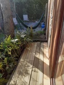a porch with a hammock in a backyard at Pez Espada in Punta del Este