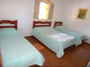 Un pat sau paturi într-o cameră la Pousada do Peralta