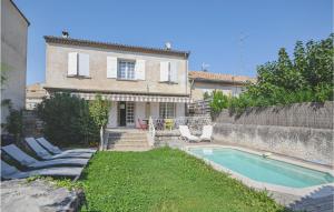 a house with a swimming pool in front of a yard at Awesome Home In Tulette With Wifi in Tulette +17 photos