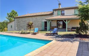 a house with a swimming pool in front of a house at Nice Home In Sainte Gemme With Wifi, Private Swimming Pool And Outdoor Swimming Pool in Sainte-Gemme