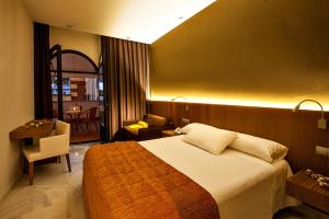 Posteľ alebo postele v izbe v ubytovaní Hotel Barrameda