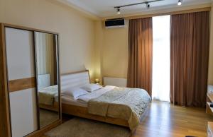 Postel nebo postele na pokoji v ubytování Happy Stay Hotel