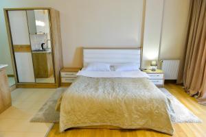 Postel nebo postele na pokoji v ubytování Happy Stay Hotel