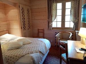 Postel nebo postele na pokoji v ubytování Hotel les Sapins