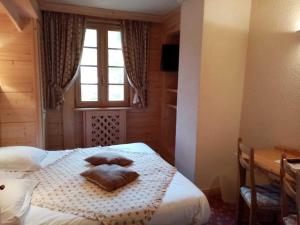 Postel nebo postele na pokoji v ubytování Hotel les Sapins