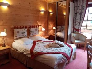 Postel nebo postele na pokoji v ubytování Hotel les Sapins