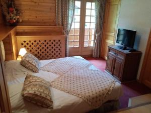 Postel nebo postele na pokoji v ubytování Hotel les Sapins