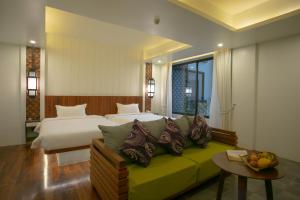 Voodi või voodid majutusasutuse HARI Residence & Spa toas