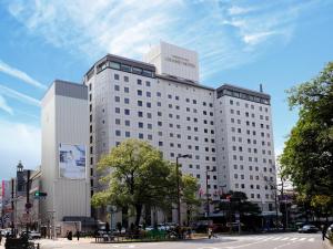 a large white building on a city street at Nishitetsu Grand Hotel in Fukuoka