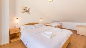 Ein Bett oder Betten in einem Zimmer der Unterkunft Damir & Gordana