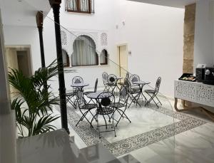 a group of chairs and tables in a room at Hotel boutique Palacio de la Veracruz in Alcalá la Real