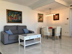 a living room with a couch and a table at Mesana 102 / Penthouse in Calpe