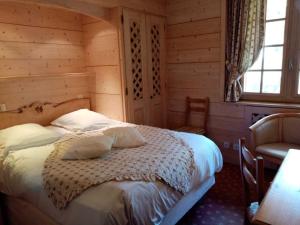Postel nebo postele na pokoji v ubytování Hotel les Sapins
