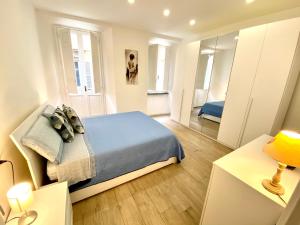 A bed or beds in a room at APARTMENT VITERBO CENTRO CORSO