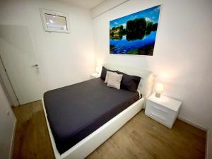 Posteľ alebo postele v izbe v ubytovaní APARTMENT VITERBO CENTRO CORSO