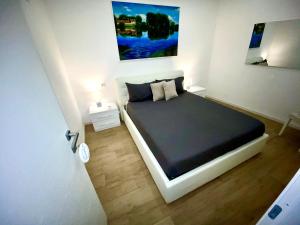 Posteľ alebo postele v izbe v ubytovaní APARTMENT VITERBO CENTRO CORSO