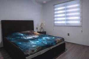 Säng eller sängar i ett rum på Apartman Radjen