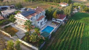 an aerial view of a house with a swimming pool at Infinity Ruby Hotel in Fethiye