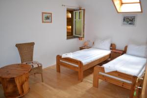 a room with two twin beds and a table at Ferienwohnung Zauner in Hallstatt
