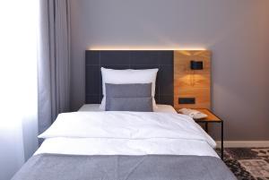 Postel nebo postele na pokoji v ubytování Coffee Fellows Hotel Trier