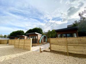 a row of houses behind a wooden fence at Elletson Park in Preston