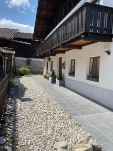 a walkway next to a building with a balcony at Ferienhaus-Aladdin in Garmisch-Partenkirchen