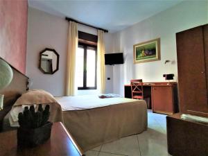 TV a/nebo společenská místnost v ubytování Hotel Venini