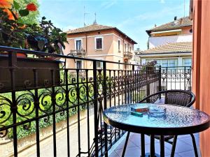 a small table on a balcony with a view of a building at Hotel Venini in Milan