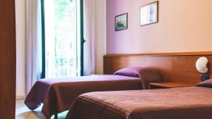 Postel nebo postele na pokoji v ubytování Hotel Venini