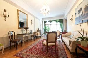 a living room with a couch and a table at Charming large palazzo in center Venice for up to 9 people in Venice