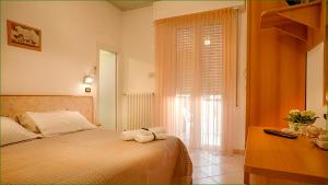Posteľ alebo postele v izbe v ubytovaní Hotel Verdemare