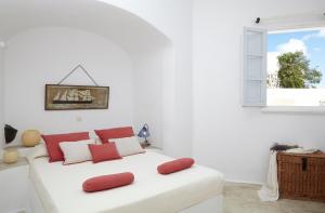A bed or beds in a room at Altana Heritage Suites