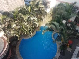 Bazén v ubytování Hotel Arena Caliente nebo v jeho okolí