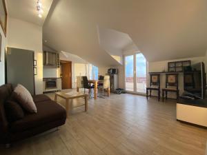 a living room with a couch and a table at Apartments Grozdana in Gradac