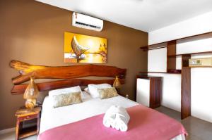 Postel nebo postele na pokoji v ubytování Vila Coqueiros Boutique Hotel