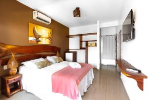 Postel nebo postele na pokoji v ubytování Vila Coqueiros Boutique Hotel
