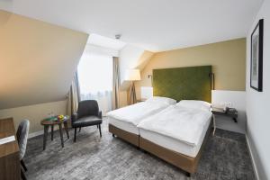 Ένα ή περισσότερα κρεβάτια σε δωμάτιο στο Hotel Löwen am See