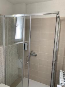 a shower with a glass door in a bathroom at Villa Detelina in Sapareva Banya +38 photos