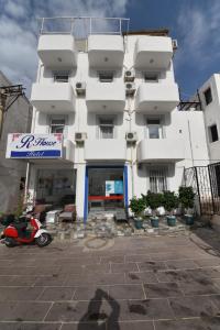 a building with a scooter parked in front of it at R HOUSE HOTEL in Bodrum City