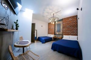 Postel nebo postele na pokoji v ubytování Coaranda Hotel Boutique
