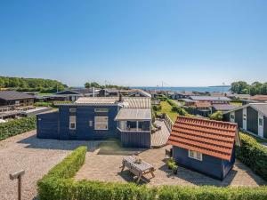 an aerial view of a tiny house in a town at 6 person holiday home in Juelsminde in Sønderby
